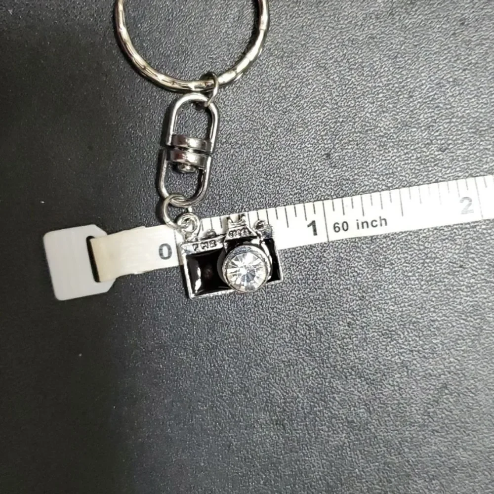 Silver tone camera key fob